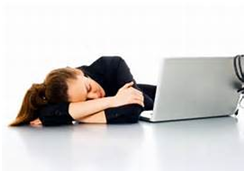 Woman with head down sleeping on desk