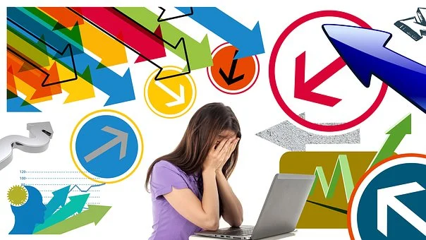 Stress Girl Image A woman frustrated at her laptop with many confusing arrows around her.
