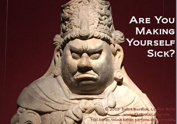 A fierce stone statue with a stern expression and text overlay.
