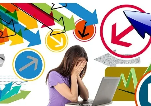 Stress Girl Image A woman frustrated at her laptop with many confusing arrows around her.
